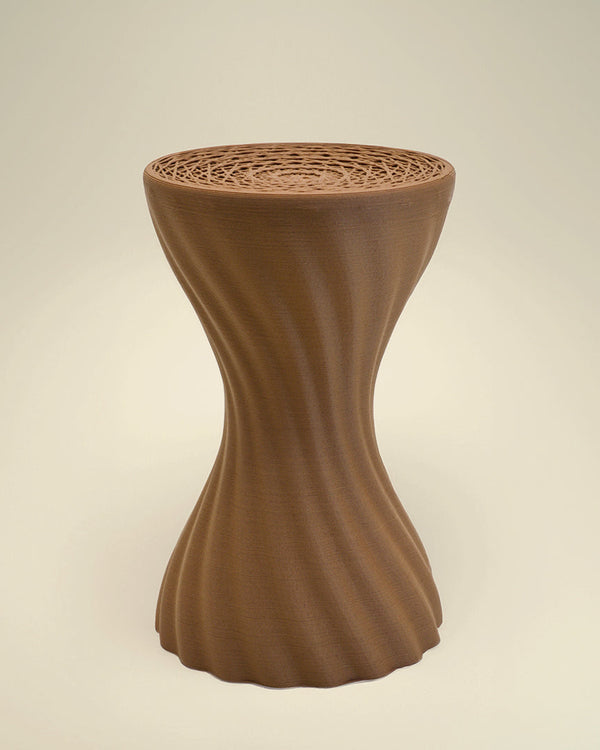 Detail view of the wood tone mandala lattice on the 3D printed stool by Fab.Pub
