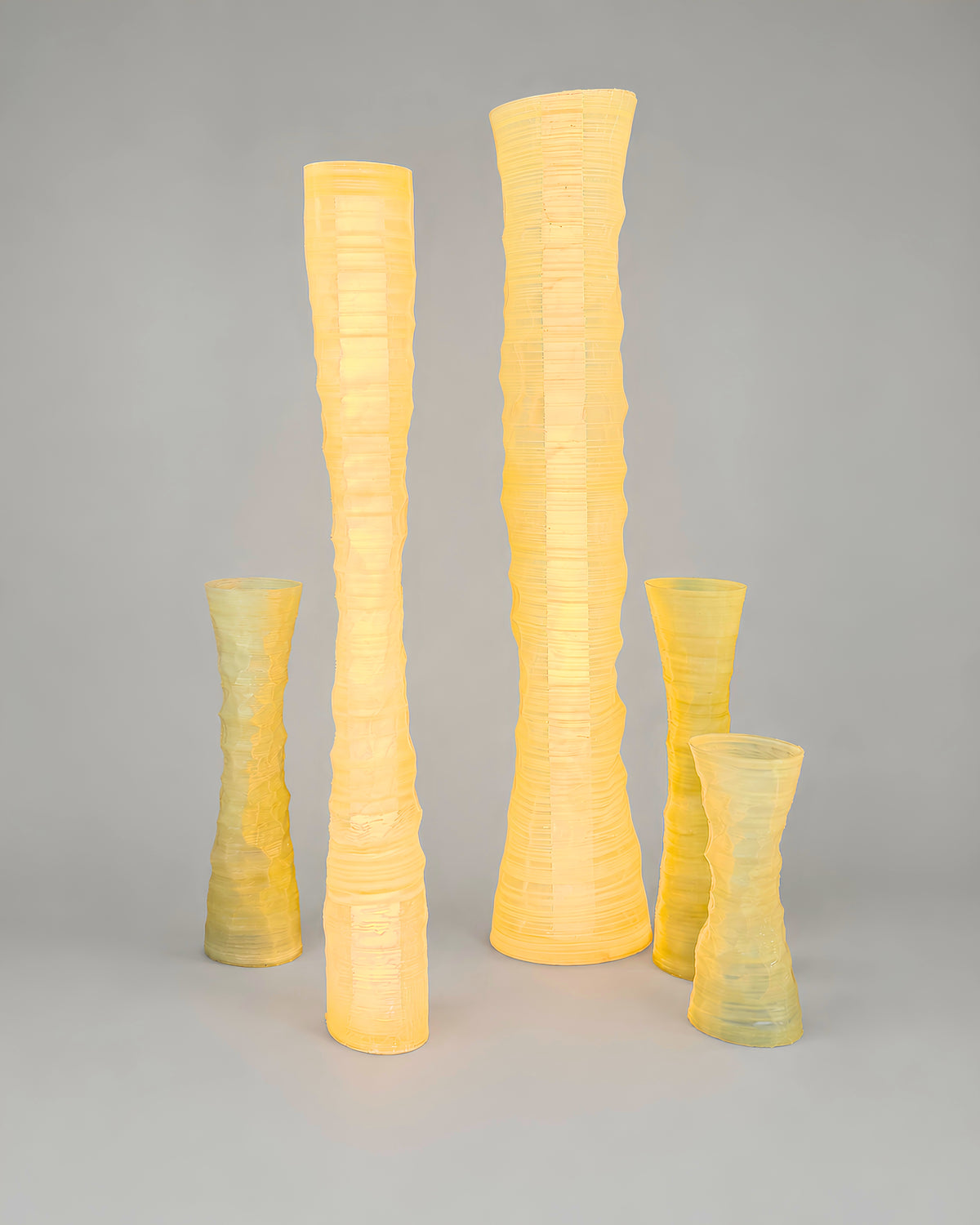 Five illuminated, translucent 3D-printed lighting sculptures in varying heights from After the Last Sip.