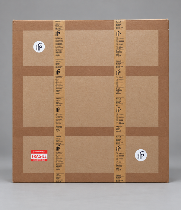 Fab.Pub shipping box for the Mandala Wall Art, a flat square kraft carton sealed with branded paper tape and a fragile label