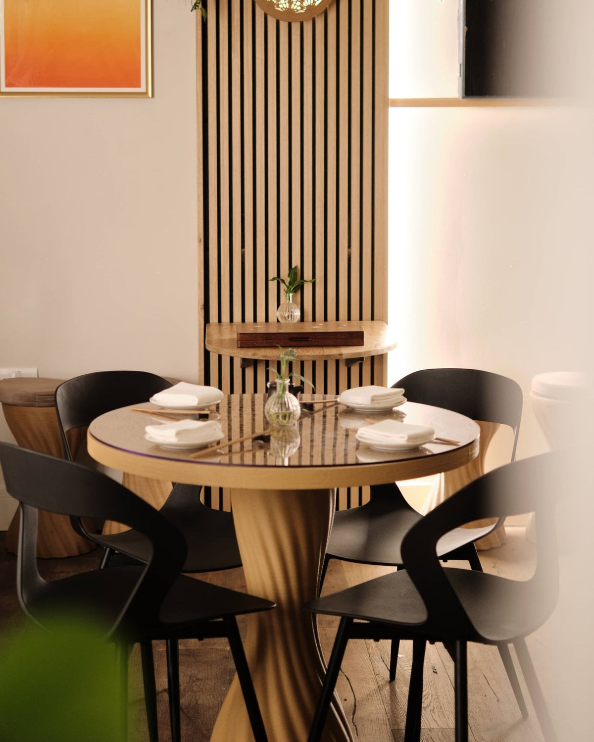 Mandala Bistro Table by Fab.Pub in a cafe interior setting