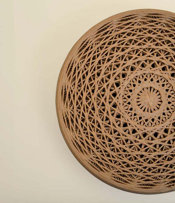 Mandala Stool Brown Wood in an interior setting, part of the Mandala Wall Art + Stool bundle.