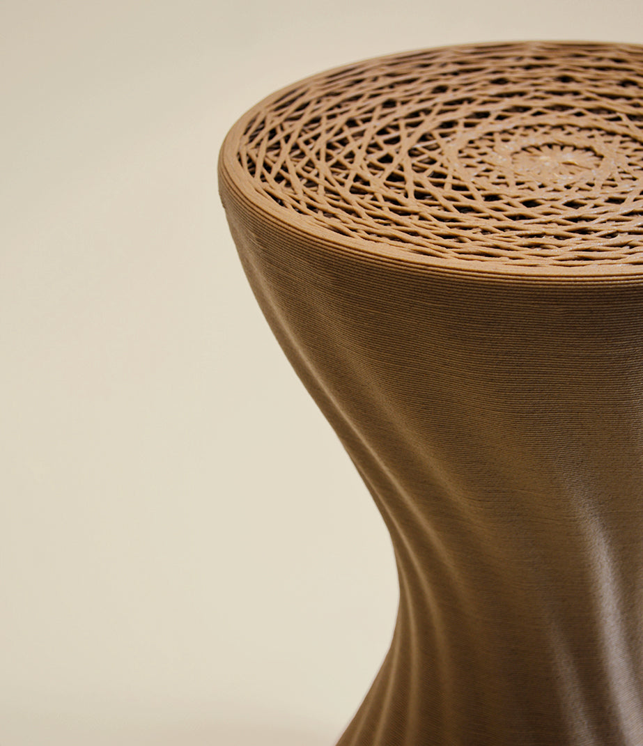 Close detail of the Mandala wood stool, revealing its open lattice and printed layers
