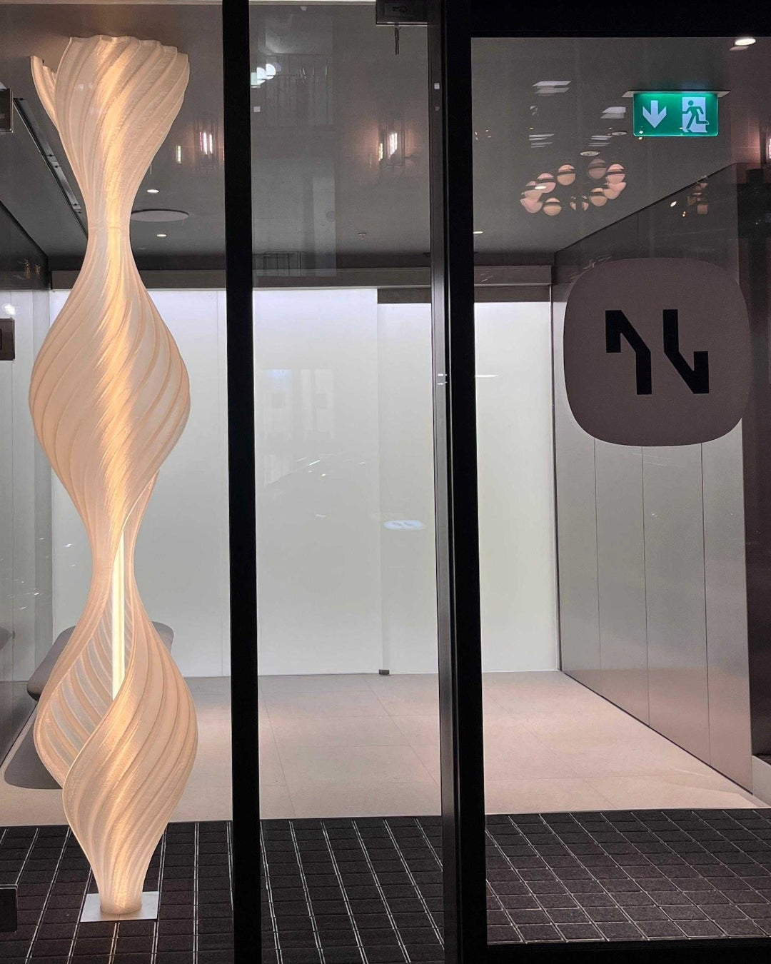 The completed illuminated sculptural helix at Neko Health Birmingham.