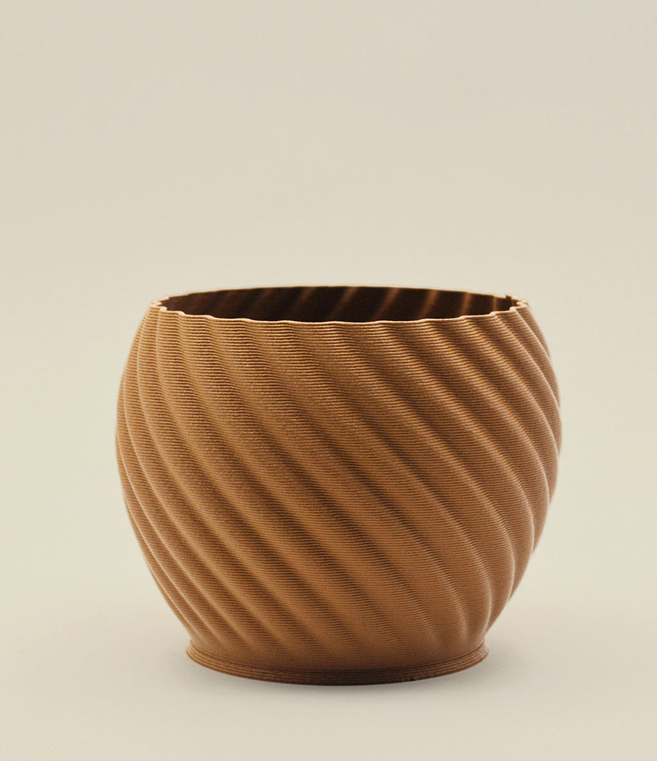 Brown Wood Mandala planter showing the finish and shape. Trio includes one small, one medium and one large; one planter pictured.